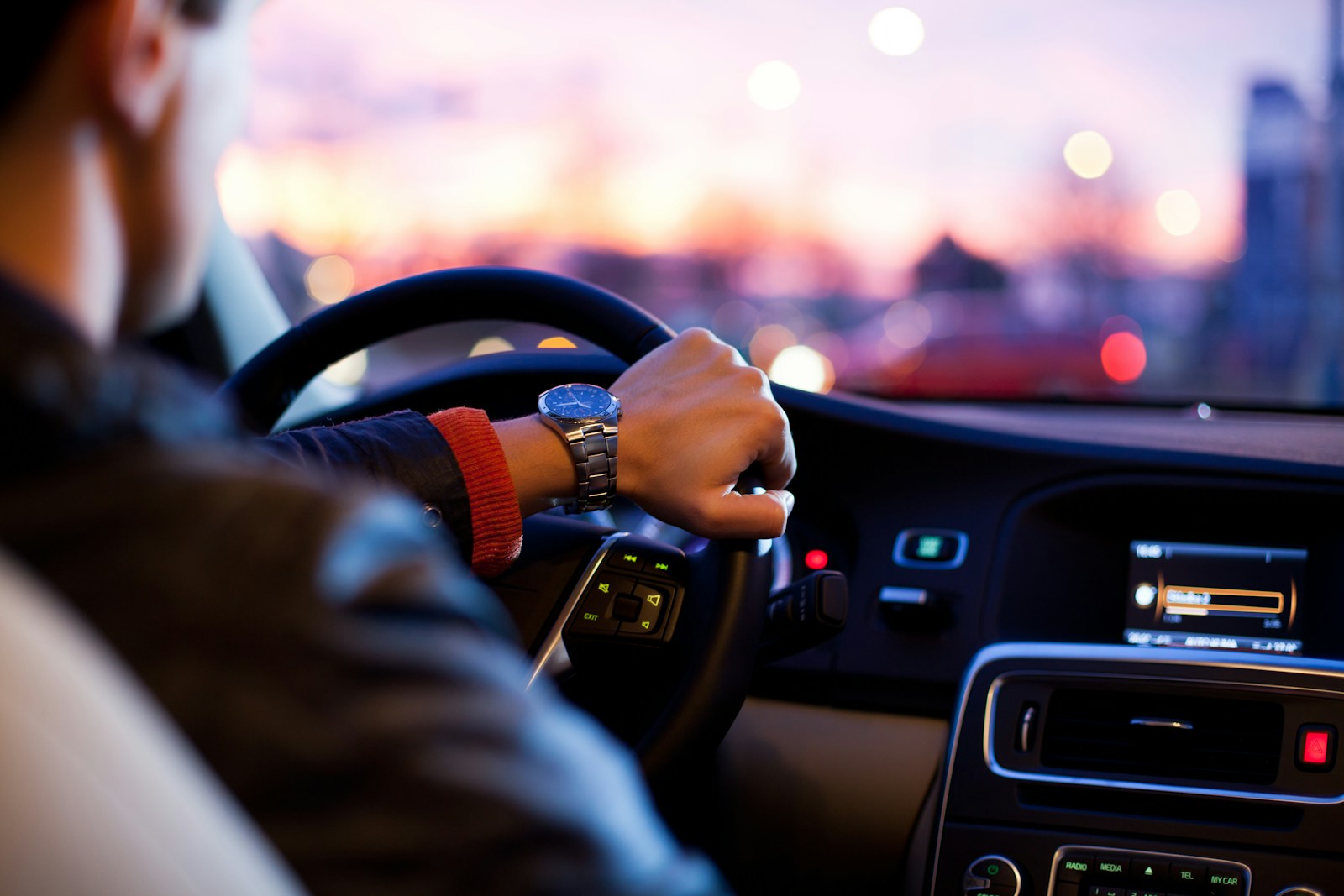man driving a car wearing wristwatch, auto